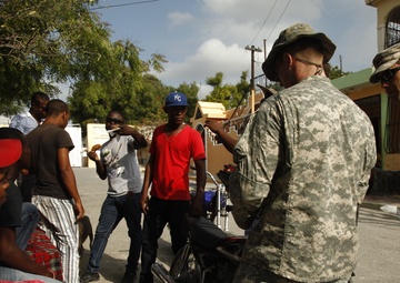 399th Psychological Operations conducts a post assessment of a medical readiness training exercise