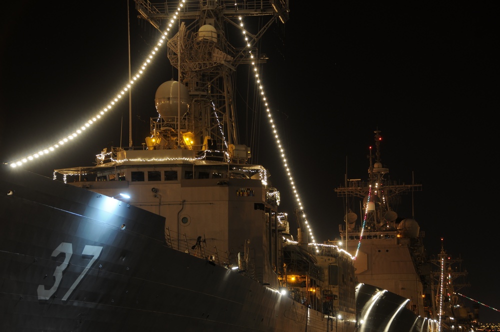USS Crommelin lights up the night