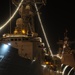 USS Crommelin lights up the night