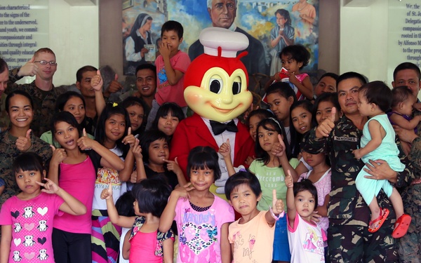 Philippine, US service members, children play together at Children’s Home