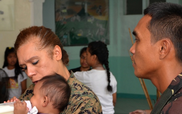 Philippine, US service members, children play together at Children’s Home