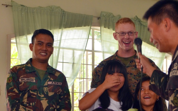 Philippine, US service members, children play together at Children’s Home