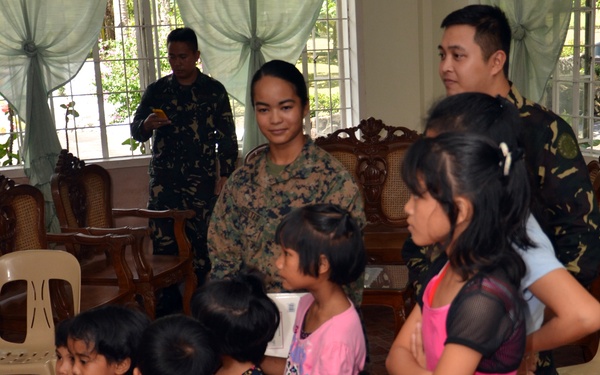 Philippine, US service members, children play together at Children’s Home