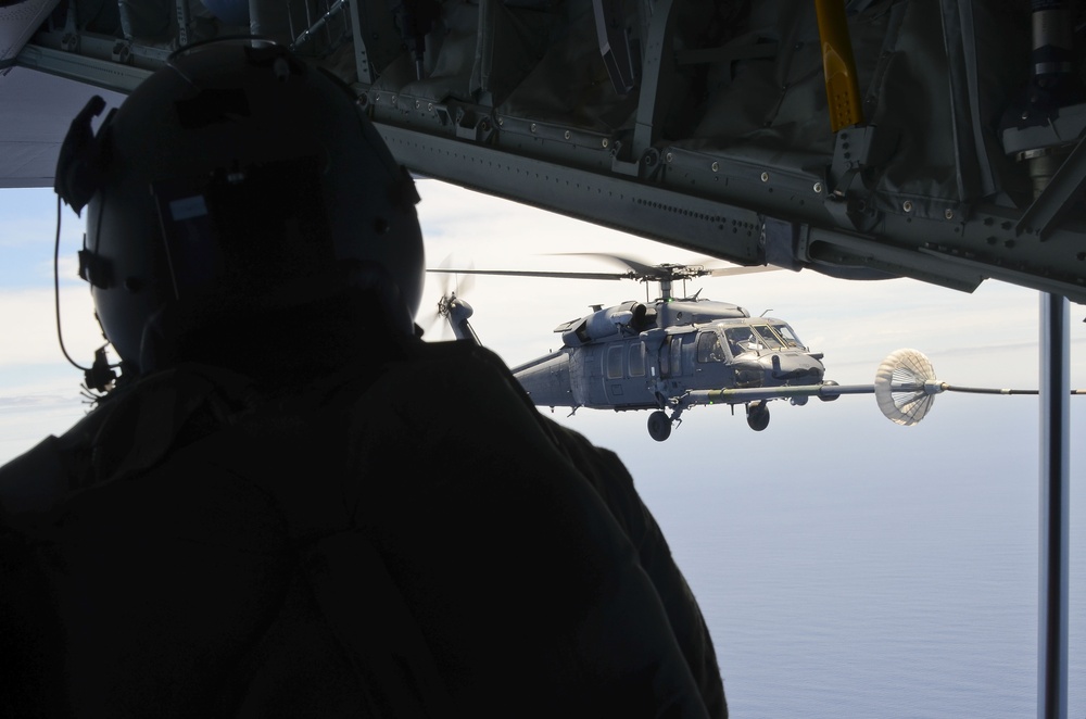 79th Rescue Squadron HC-130J Combat King II flies injured sailors to California