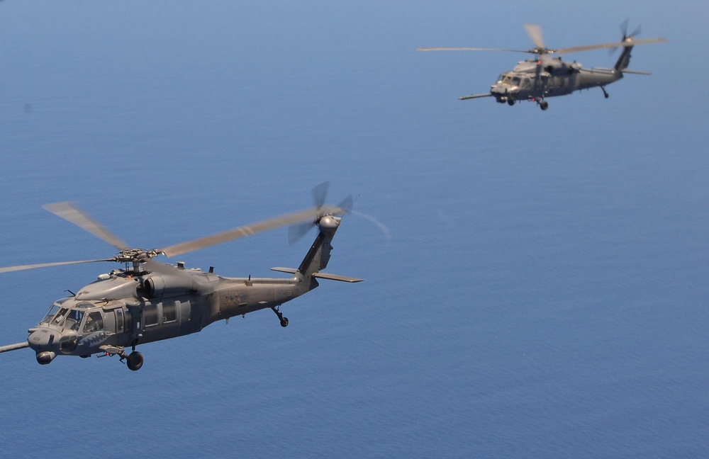 79th Rescue Squadron HC-130J Combat King II flies injured sailors to California