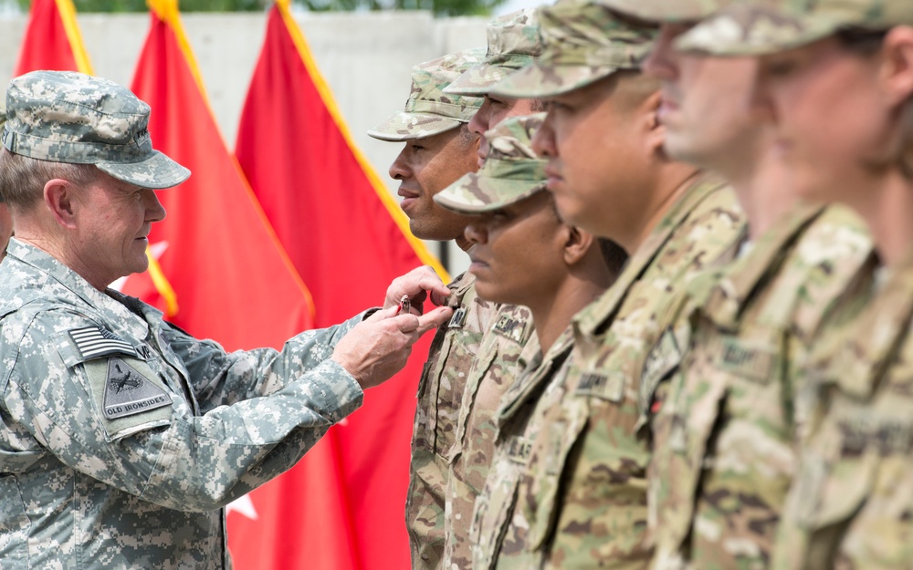 Gen. Martin E. Dempsey presents Bronze Star to Soldier at Bagram Air Field