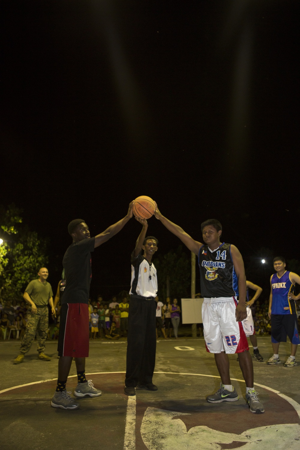 AFP service members, local residents of Barangay Bigaa and U.S. service members participate in a friendship basketball game