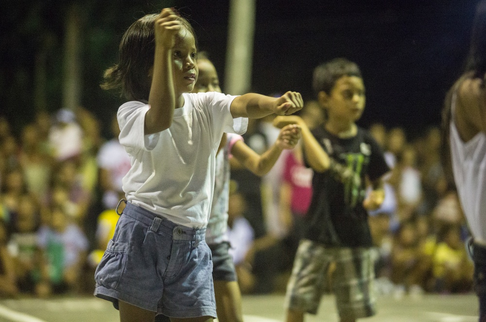 AFP service members, local residents of Barangay Bigaa and U.S. service members participate in a friendship basketball game