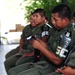 A Guatemalan soldier examines a combat application tourniquet during a Combat Life Savers (CLS) course