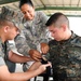 Capt. Celine Fernandes, a registered nurse with the 349th Combat Support Hospital, teaches Guatemalan Soldiers during a Combat Life Savers (CLS) course.
