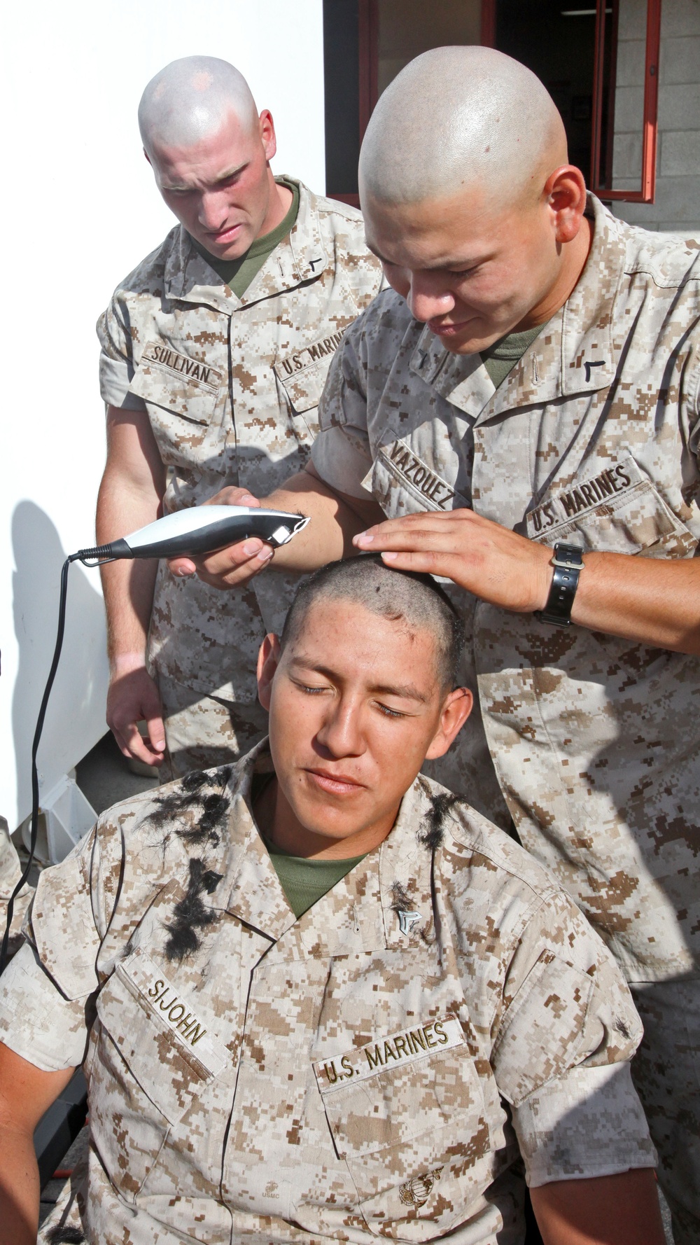 GSMT Co. Marines shave heads for cancer