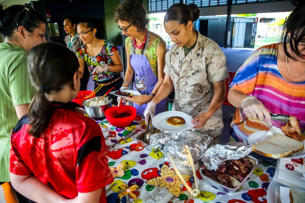 MRF-D Marines cook food for Alawa primary school