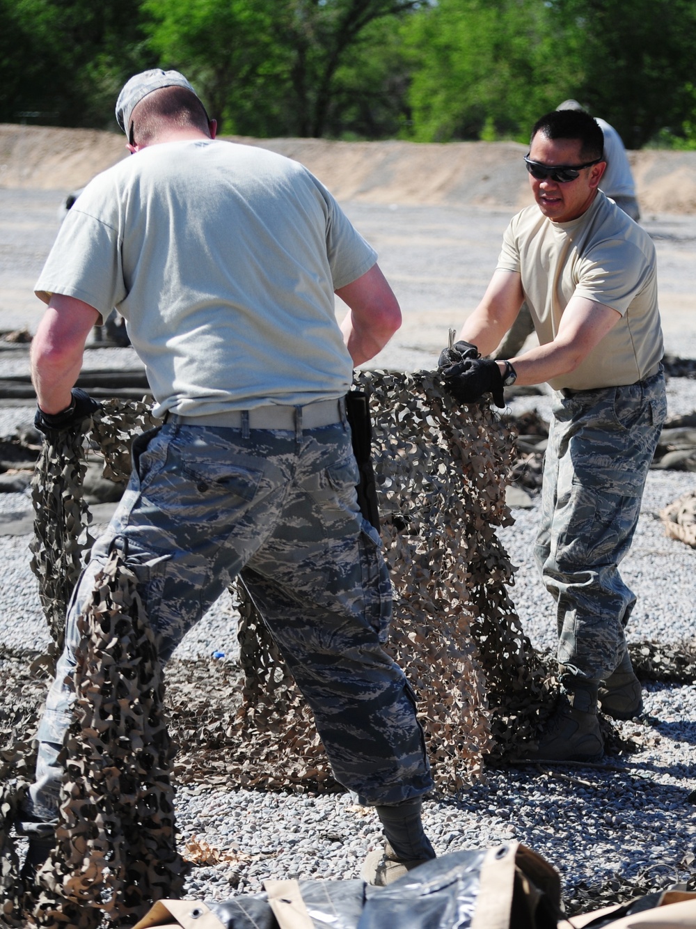 Dirty Details: Airmen demilitarize camouflage netting