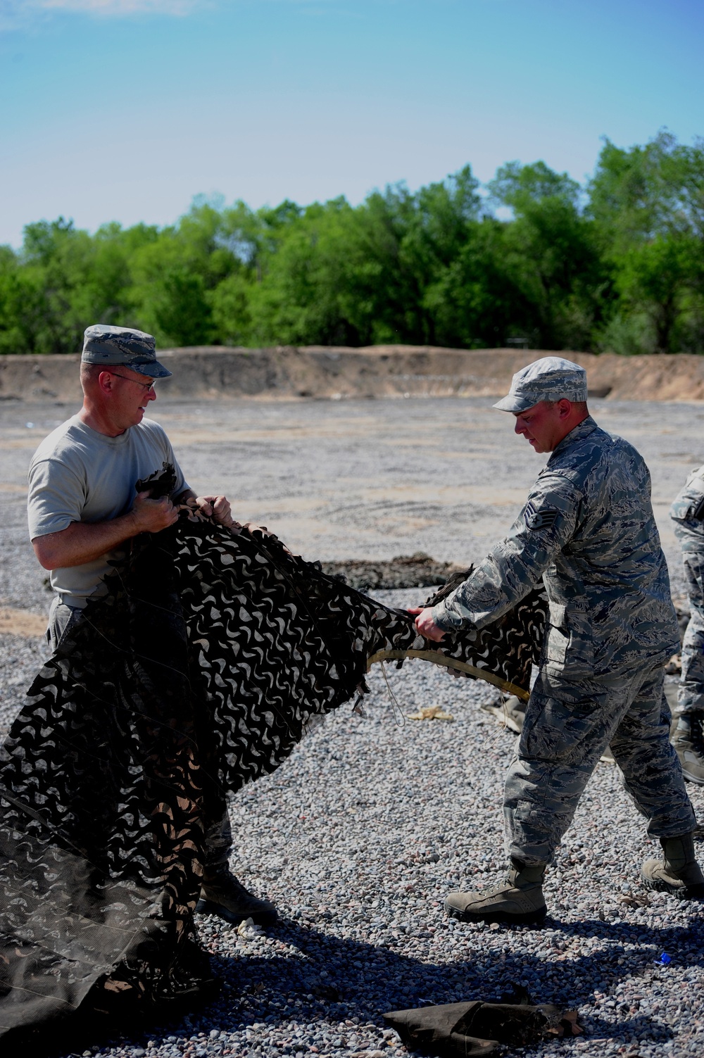 Dirty Details: Airmen demilitarize camouflage netting