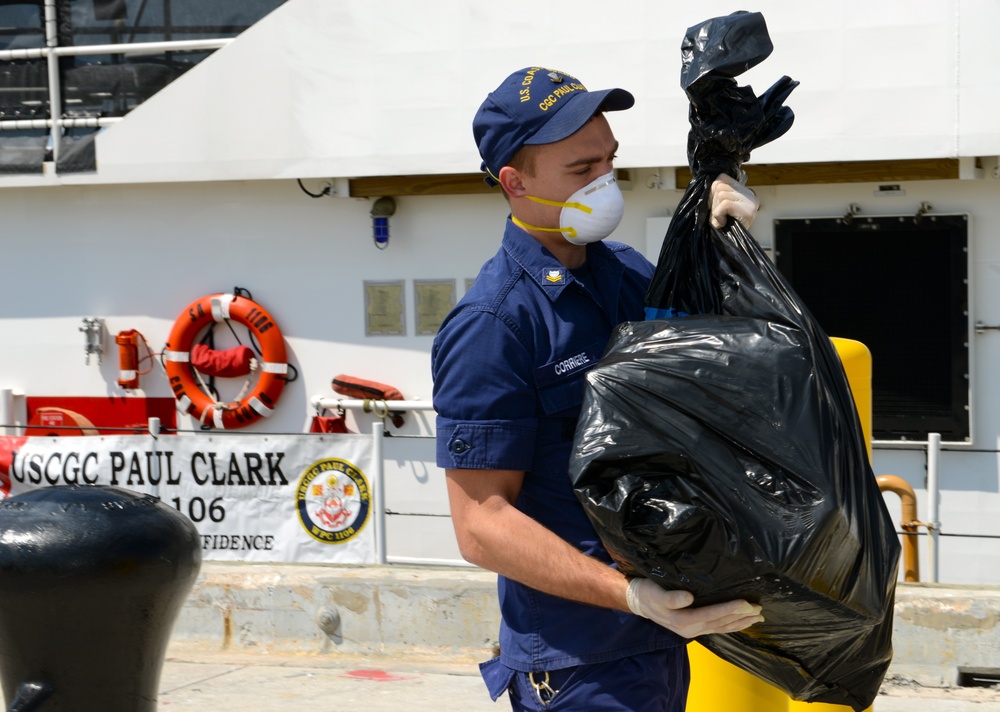 Coast Guard Cutter Paul Clark crew members offload contraband