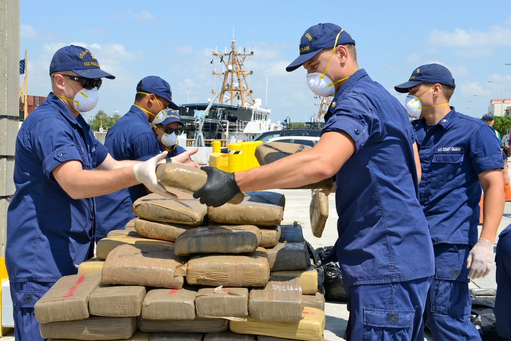 Coast Guard Cutter Paul Clark crew members offloads contraband