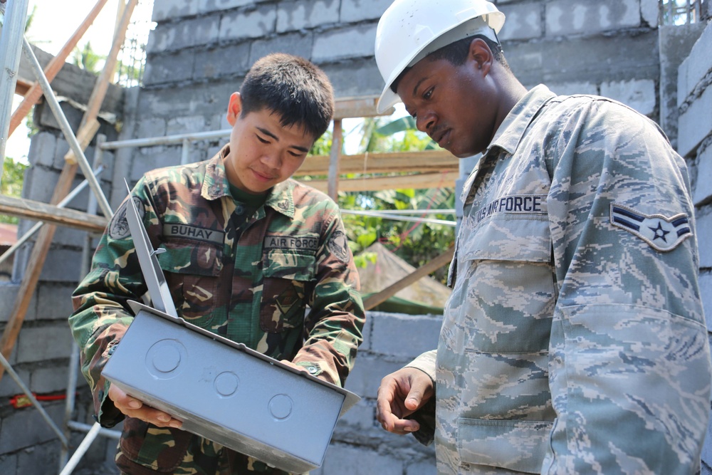 Members of the AFP U.S. armed forces conduct build a comfort room and school room in Guinobatan, Philippines