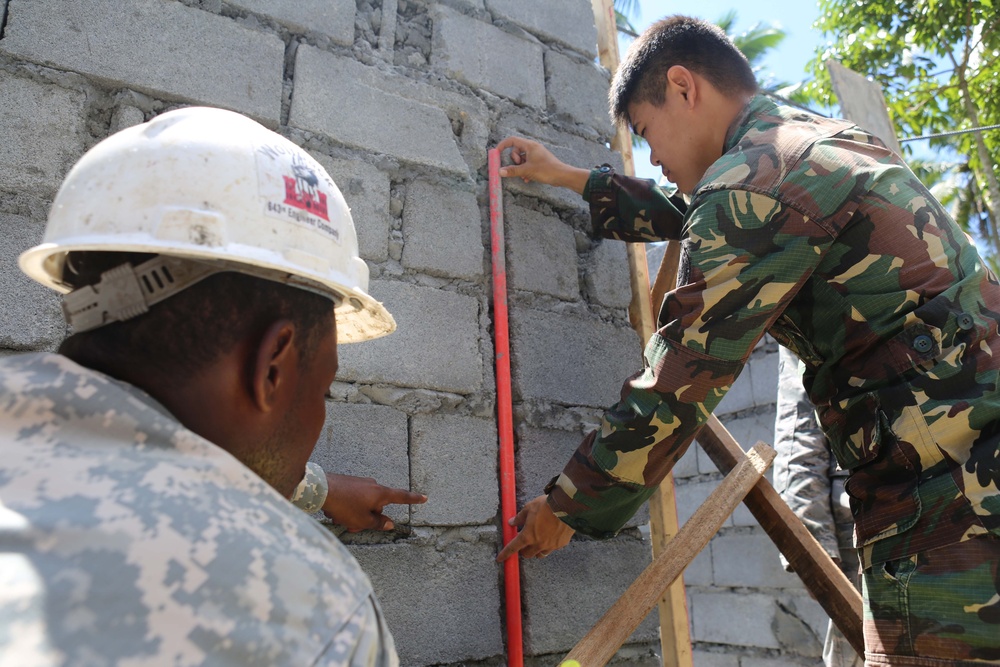 Members of the AFP U.S. armed forces conduct build a comfort room and school room in Guinobatan, Philippines