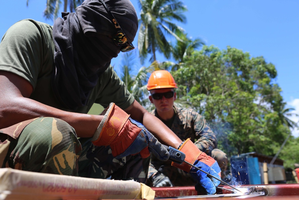 Members of the AFP U.S. armed forces conduct build a comfort room and school room in Guinobatan, Philippines