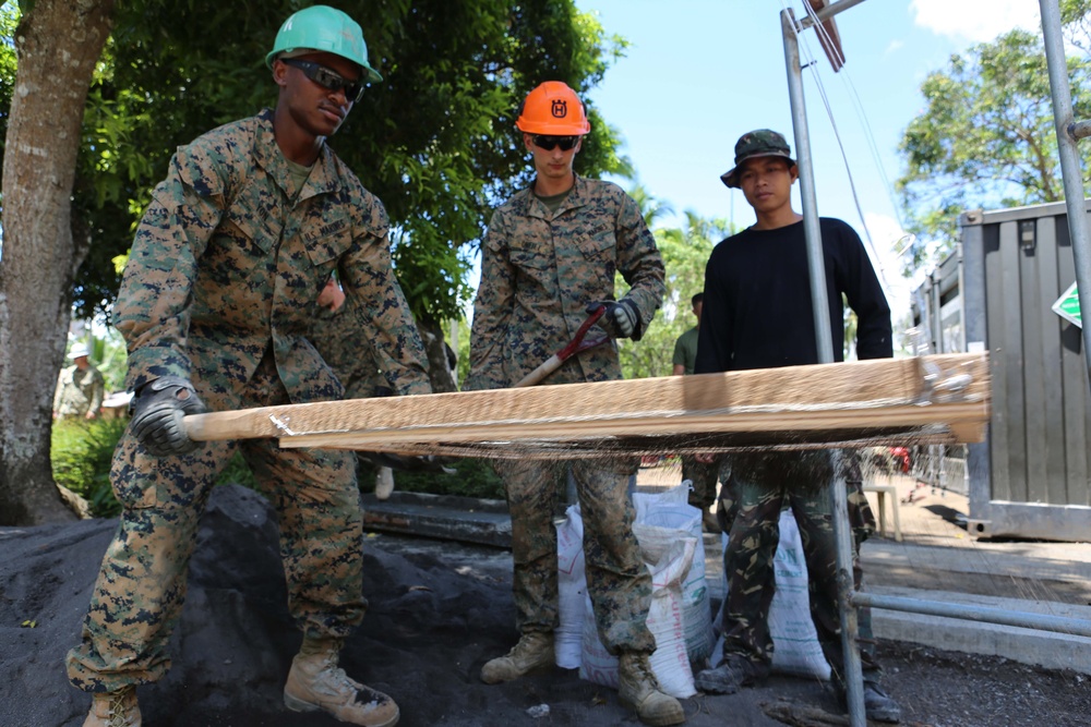 Members of the AFP U.S. armed forces conduct build a comfort room and school room in Guinobatan, Philippines