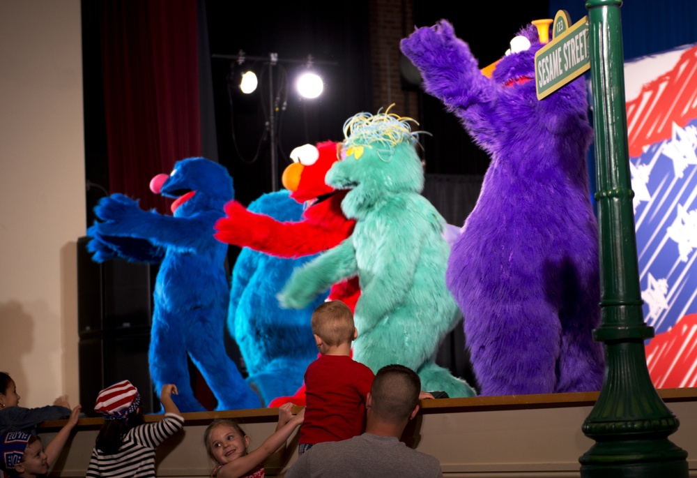 Sesame Street characters sing, dance into hearts of military children