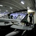 Conducting maintenance on an F/A-18C Hornet