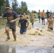 Competitors embrace warrior's way during mud run