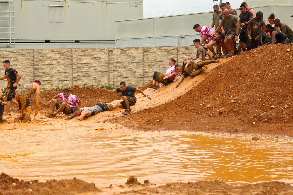 Competitors embrace warrior's way during mud run