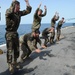 Marines conduct physical training aboard USS Mesa Verde