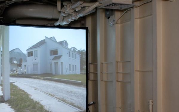 Combat Logistics Battalion 24 Marines use Indoor Simulated Marksmanship Trainer aboard USS Mesa Verde