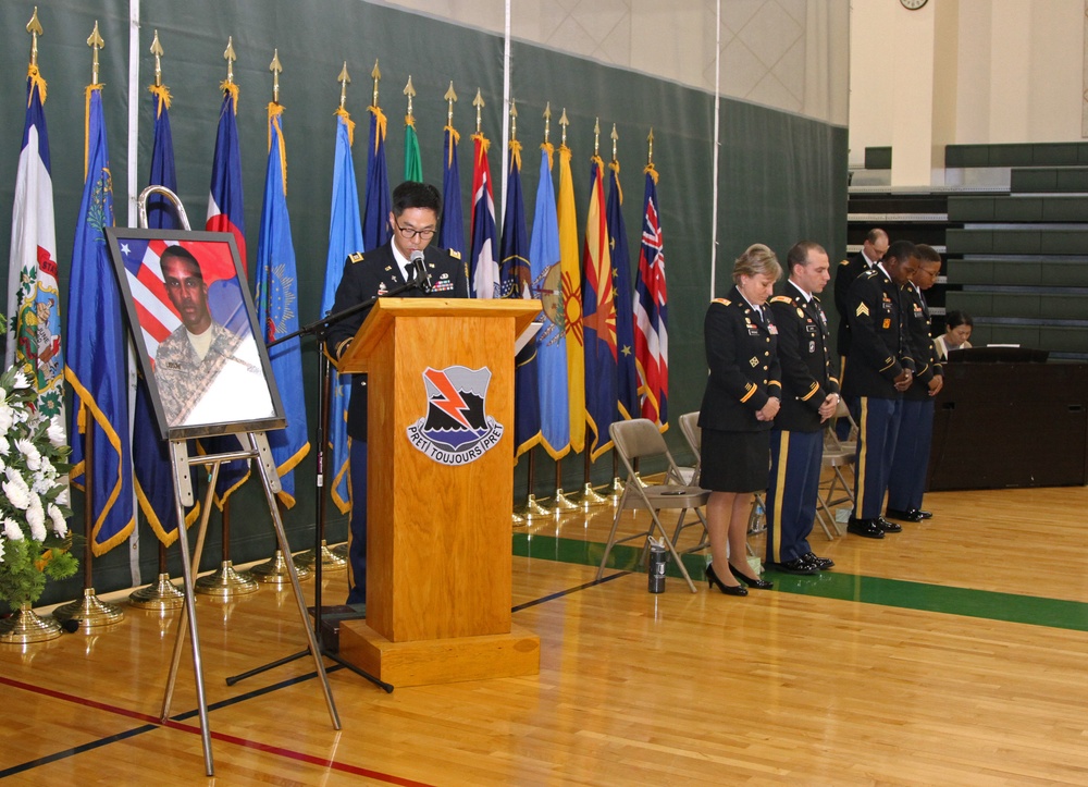 Capt. William C. Yi, chaplain for 304th ESC, speaks at the memorial service for Spc. Carl A. Lissone