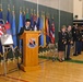 Capt. William C. Yi, chaplain for 304th ESC, speaks at the memorial service for Spc. Carl A. Lissone