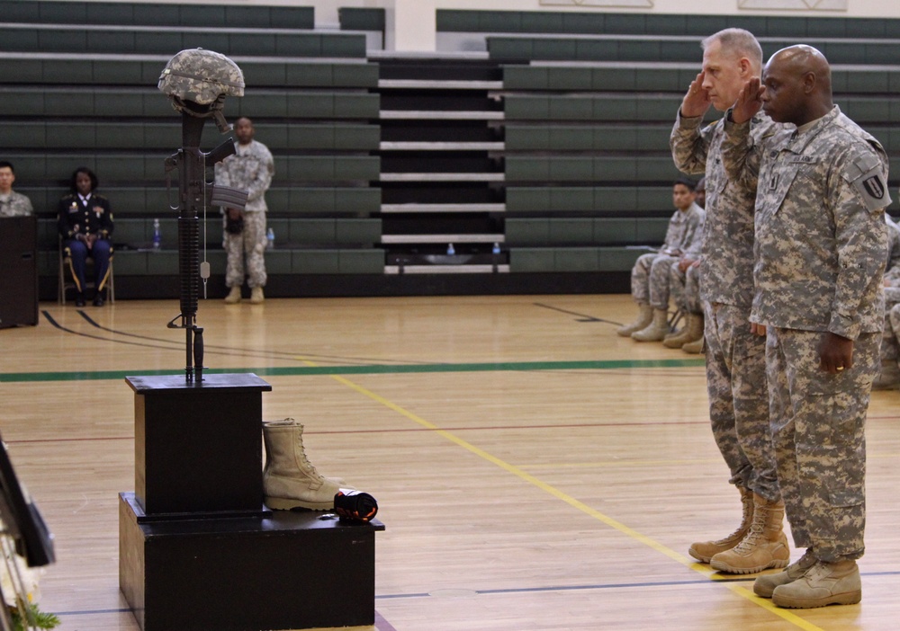 Col. Paul H. Fredenburgh III and Command Sgt. Maj. Darris Curry give their final salute