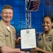 MCPON presents certificate of re-enlistment