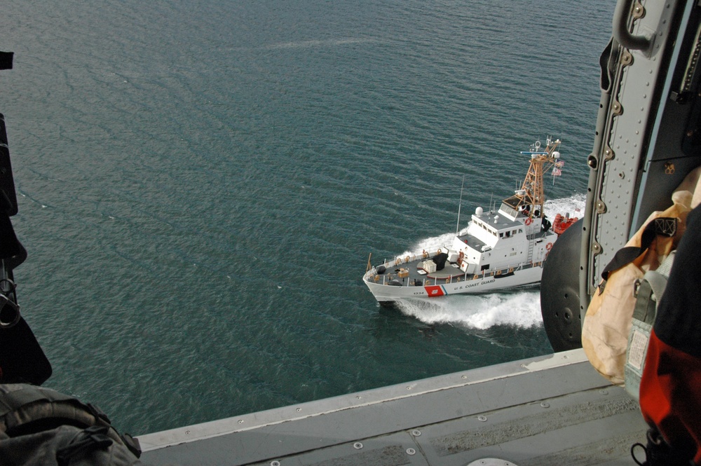 Coast Guard MH-60 Jayhawk helicopter crew encounters the Coast Guard Cutter Liberty in Southeast Alaska