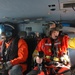 Coast Guard MH-60 Jayhawk helicopter crew performs their duties on a training flight from Sitka, Alaska