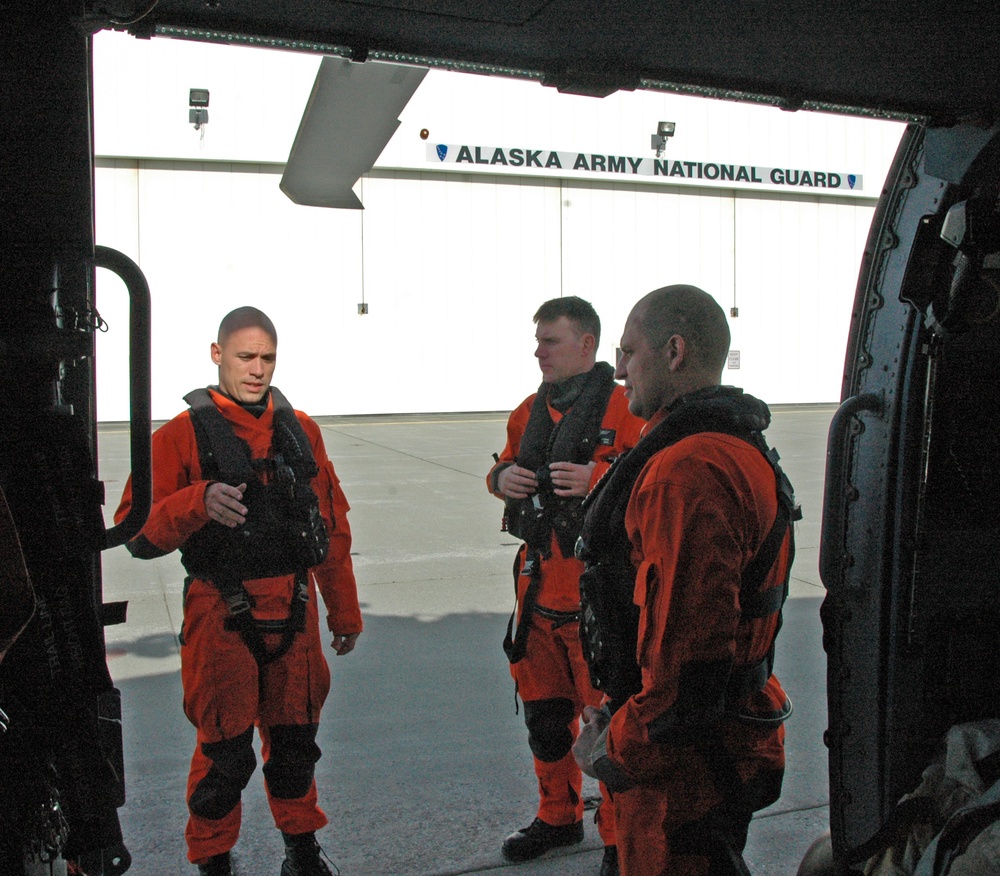 Coast Guard MH-60 Jayhawk helicopter crew prepares for departure from Juneau, Alaska
