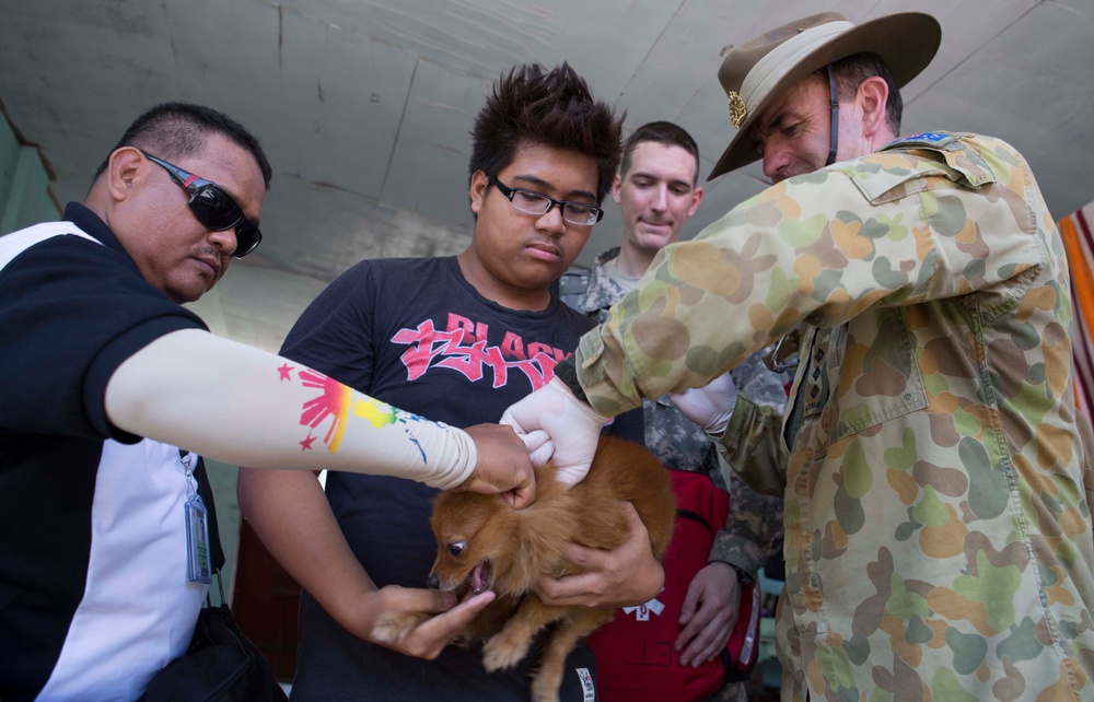 Members of the Armed Forces of the Philippines, Australian Army, and U.S. service members conduct a cooperative health engagement in Rawis province, Philippines