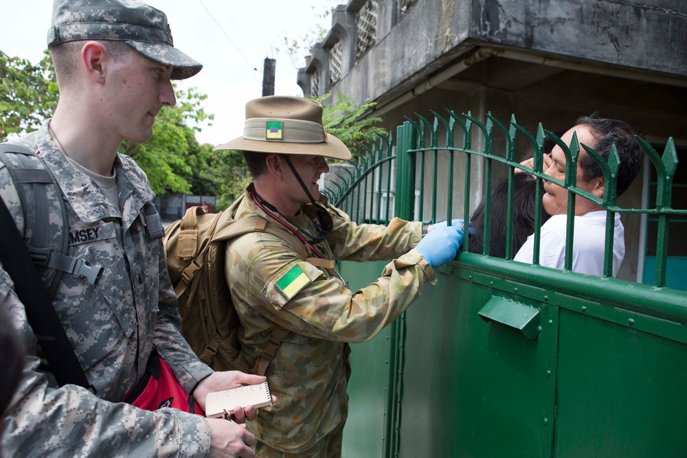 Members of the Armed Forces of the Philippines, Australian Army, and U.S. service members conduct a cooperative health engagement in Rawis province, Philippines