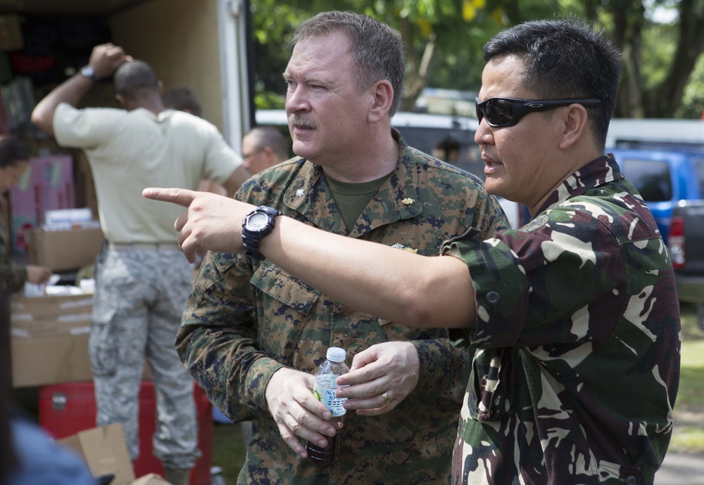 Members of the Armed Forces of the Philippines, Australian Army, and U.S. service members conduct a cooperative health engagement in Rawis province, Philippines