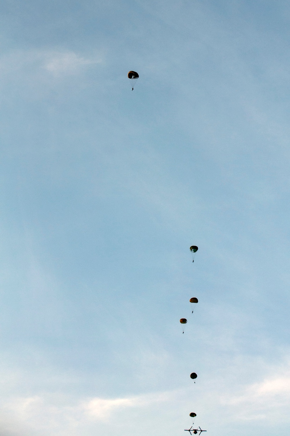 Combined special operations Service members jump ‘shoulder-to-shoulder’ in a variety of parachute scenarios during Balikatan 2014