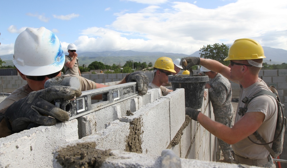 Engineers lay final concrete block