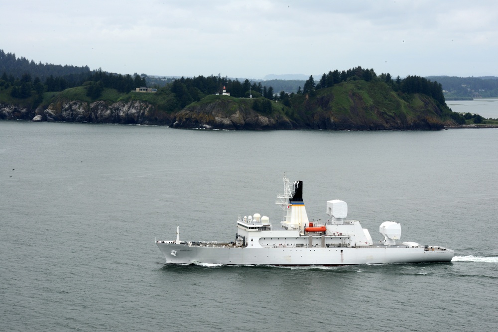 The crew of the USNS Howard O. Lorenzen (T-AGM-25) departs the Columbia River