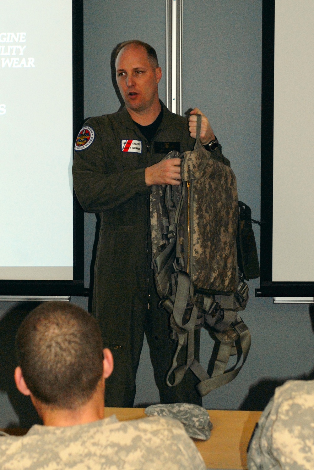 Pilots receive water evacuation training from Coast Guard rescue swimmers