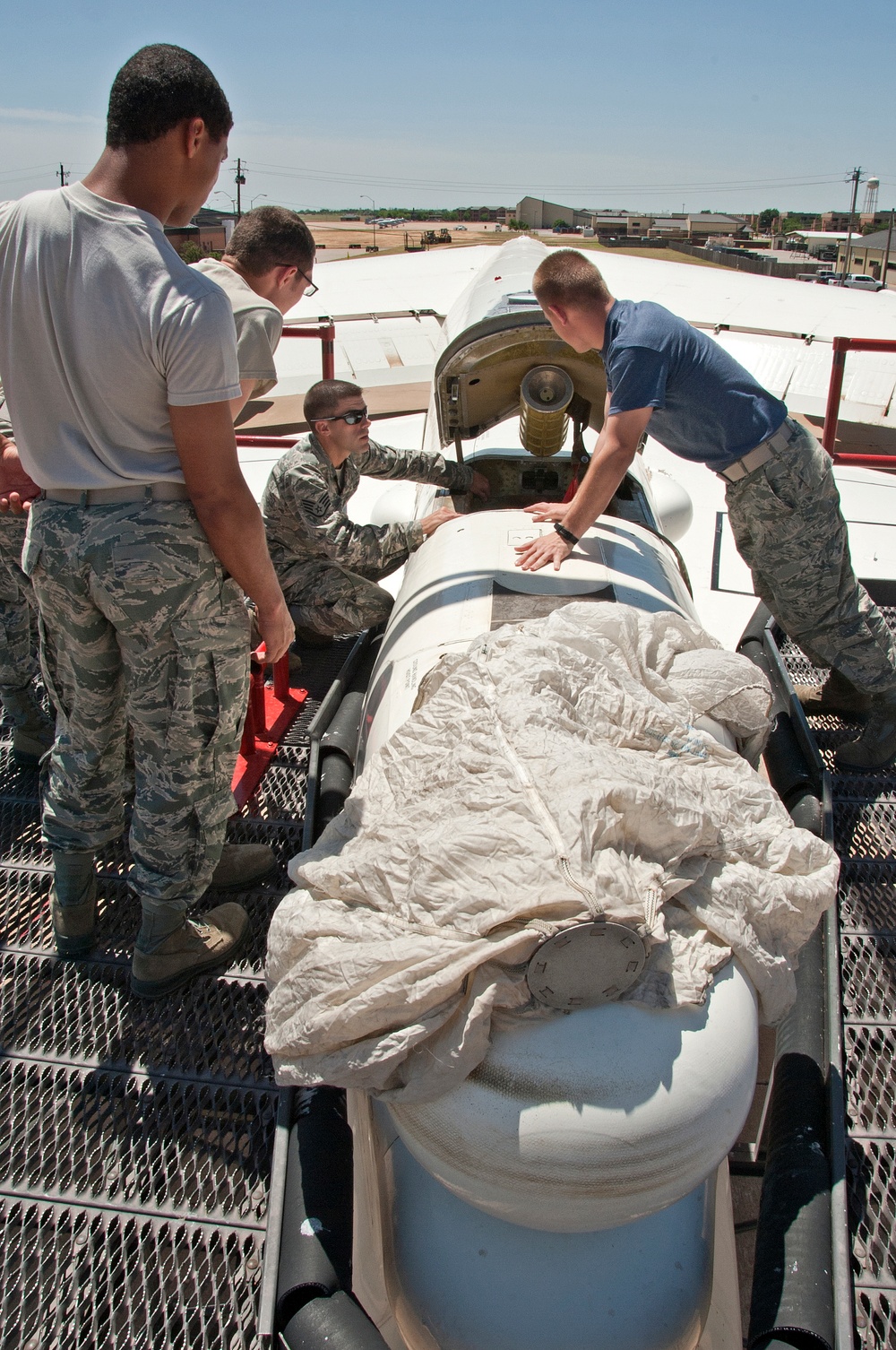 Remove and install a drogue parachute on a B-52 aircraft