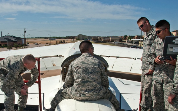 Remove and install a drogue parachute on a B-52 aircraft