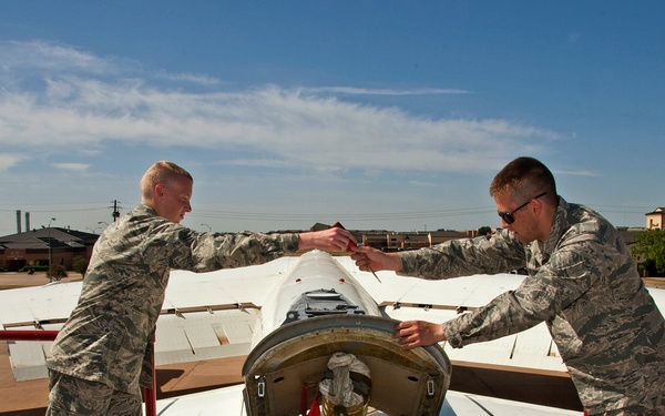 Remove and install a drogue parachute on a B-52 aircraft