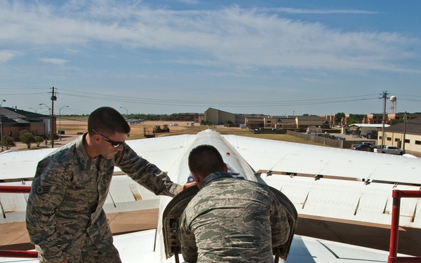 Remove and install a drogue parachute on a B-52 aircraft
