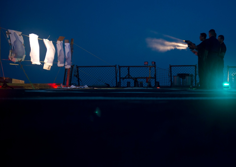 USS Arleigh Burke low-light small arms qualification exercise