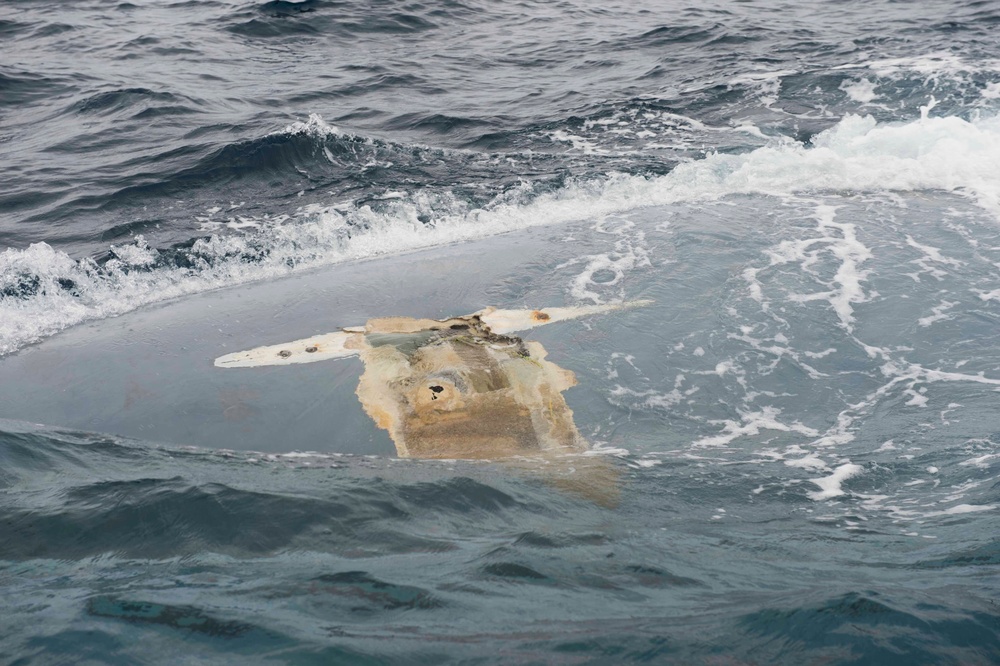 Overturned hull of the Cheeki Rafiki